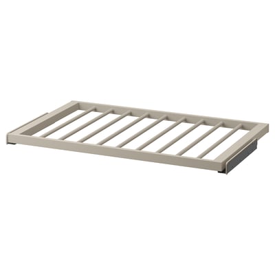 KOMPLEMENT trouser hanger in beige, modern design with slatted structure, sturdy steel frame, smooth surface for easy access.