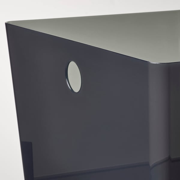 Grey storage box with round handle; sleek, modern design.