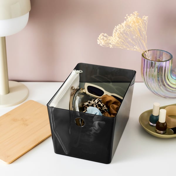 Clear storage box holds accessories, stacks neatly, protects contents from dust.