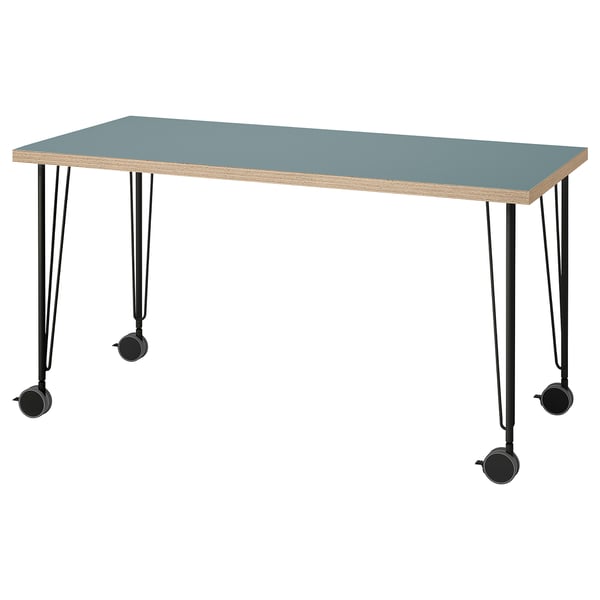 LAGKAPTEN blue desk with black metal legs, casters, and honeycomb-patterned edge, rectangular shape.