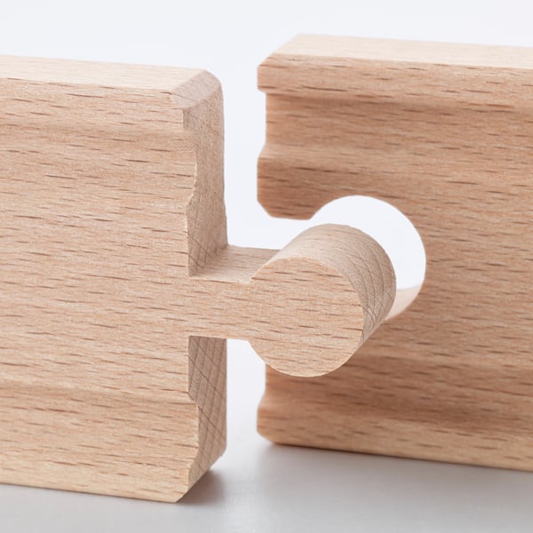 Wooden toy train track segment, finely crafted with natural beechwood texture, precise interlocking design.