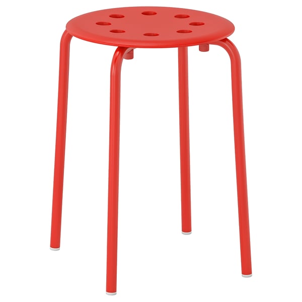 Bright red round metal stool with four legs, perforated circular seat for stacking.