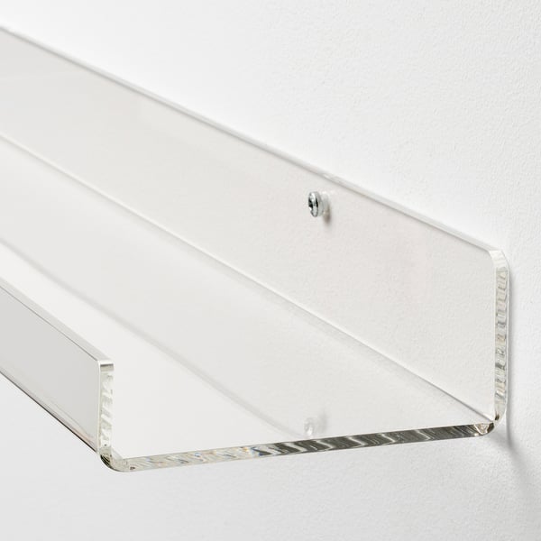 Clear acrylic wall shelf, securely mounted with visible screws, offering a modern, transparent display for decor.