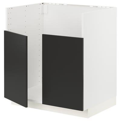 A white METOD kitchen cabinet with matt black doors. It a modern design with a frame and snap-on hinges.