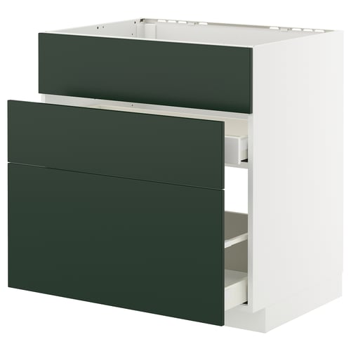 Modern green kitchen drawer unit, white cabinet, simple design.