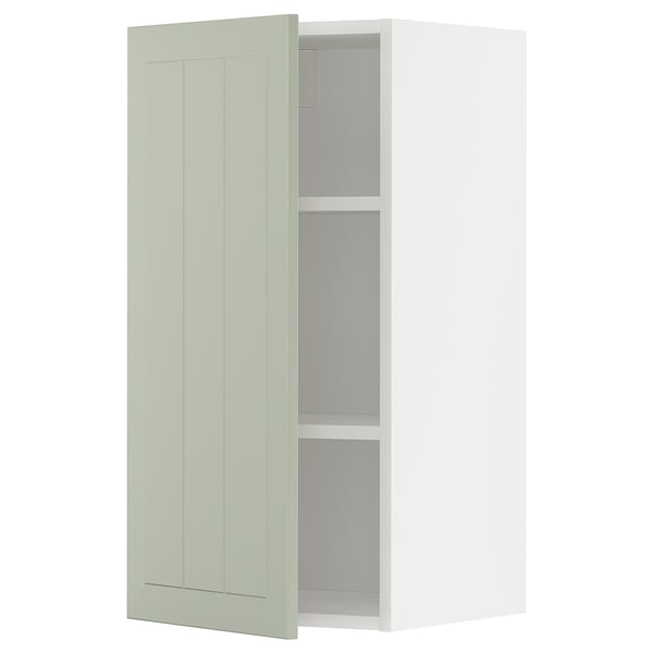 Open light green METOD cabinet with adjustable shelves.