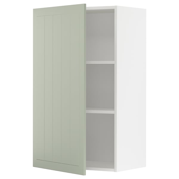 Green kitchen cabinet, open, adjustable shelf.