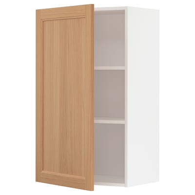 Wooden METOD wall cabinet in oak with white interior and adjustable shelf.