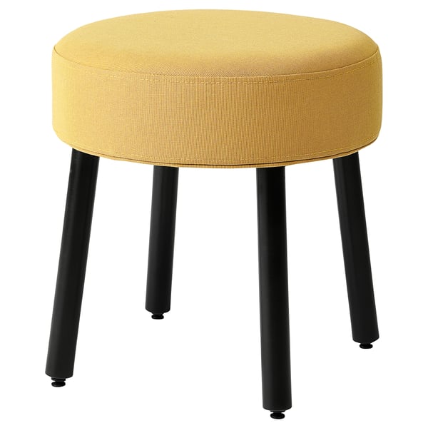 MÖRTFORS stool: round, bright yellow cushion, black metal legs, simple design.