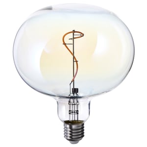 Large round light bulb, clear glass, spiral filament, warm glow.