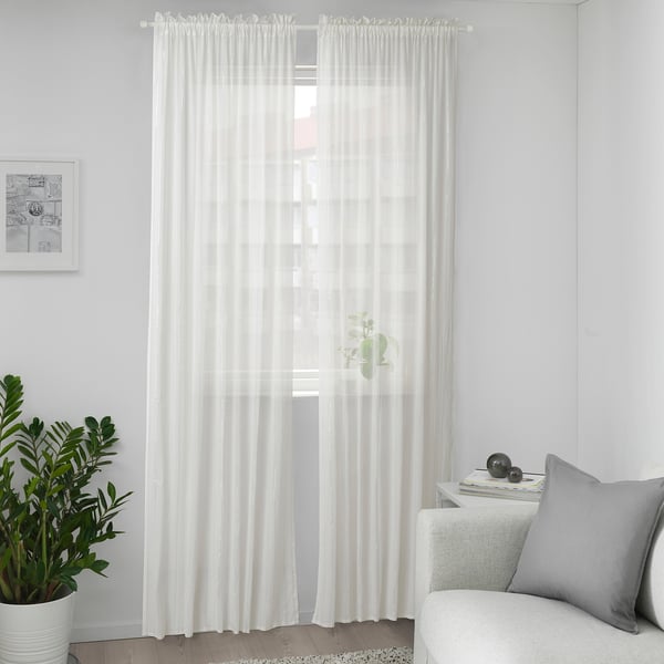 Sheer MUNKBOMAL curtains with cotton, in minimalist room.