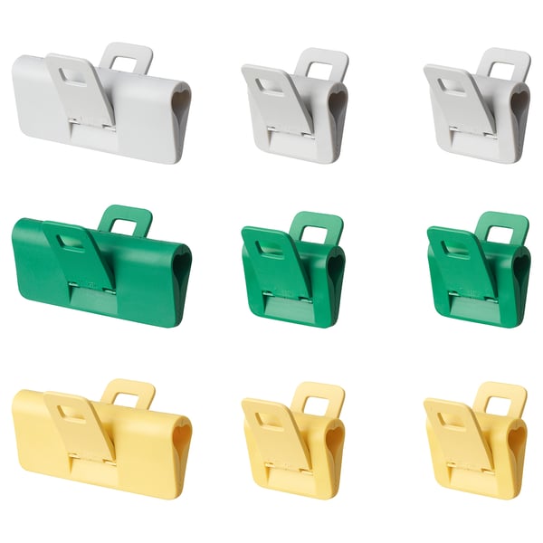 Nine sealing clips in grey, green, yellow. Foldable handles, seals bags.