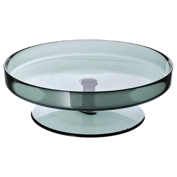 A modern green glass OMBONAD serving tray. It a sleek, circular design with a sturdy base.
