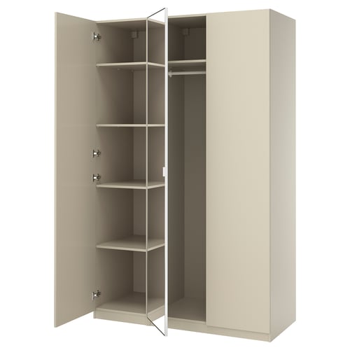 An open beige PAX wardrobe with adjustable shelves and a hanging rail.