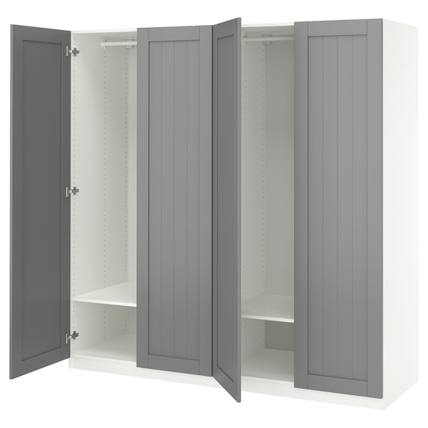 Modern grey PAX wardrobe with open doors, shelves, and hanging rod.