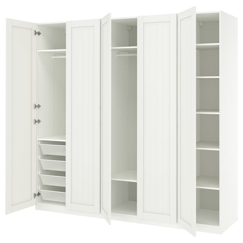 White PAX wardrobe with open doors, shelves, and mesh baskets.