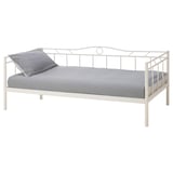A white RAMSTA day-bed with a striped mattress and one pillow, featuring a classic powder-coated steel frame.