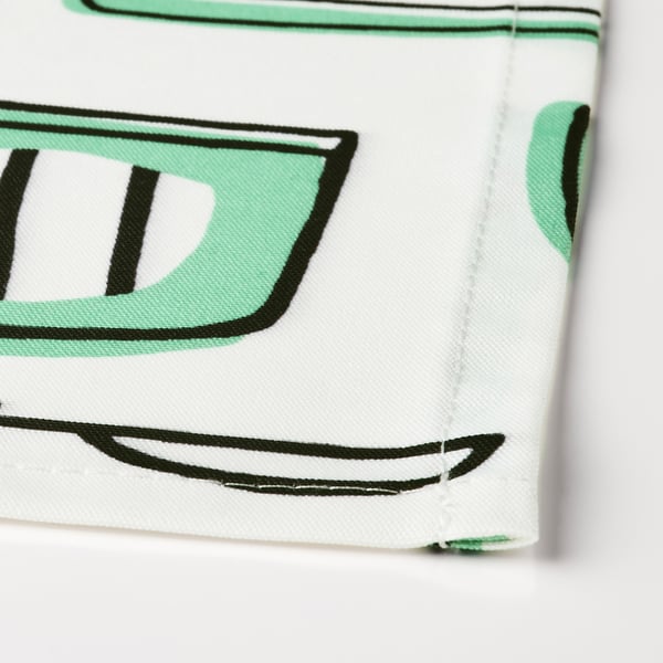 Close-up of high-quality recycled fabric, green details, sewn neatly.