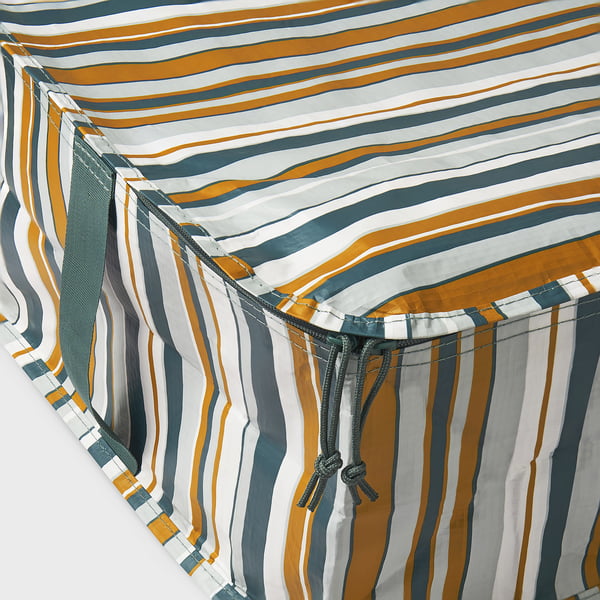 Multicoloured striped storage case with drawstring and carry handle, neatly folded.