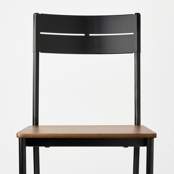 Modern black metal chair with wooden seat, sleek design, sturdy and stylish.