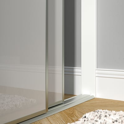 Modern sliding door stop bar, fitting between wall and door, ensuring smooth operation.