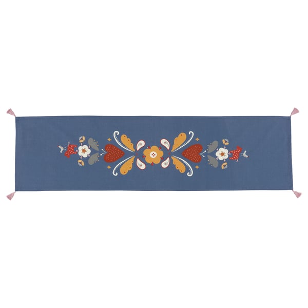 A blue, hand-embroidered table runner with colourful floral designs. Its rectangular with fringed ends and made of cotton.