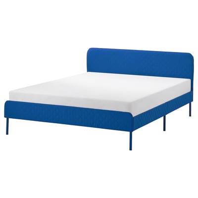 Blue SLATTUM bed frame with white mattress, quilted cover, four metal legs, boxy design.