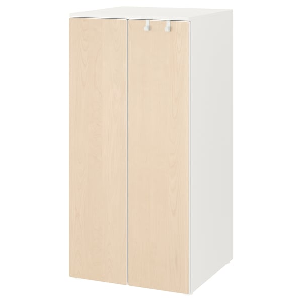 A white and light wood-colored SMÅSTAD wardrobe for children, featuring adjustable interiors and soft-closing doors.