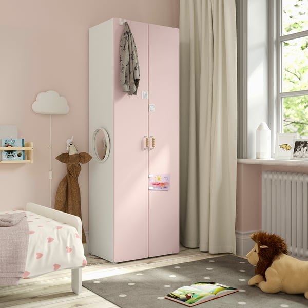 Pink kids wardrobe, SMÅSTAD, with storage & mirror in cosy bedroom.