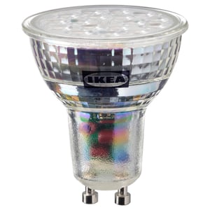 IKEAs SOLHETTA led bulb, warm-white, glass-covered, domed top, two prong base, energy-efficient.
