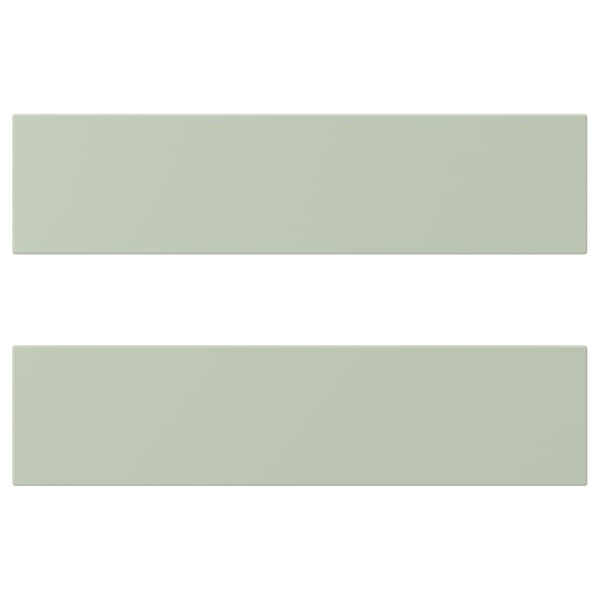 Two long, green rectangular panels with grooved textures are displayed horizontally, one above the other.