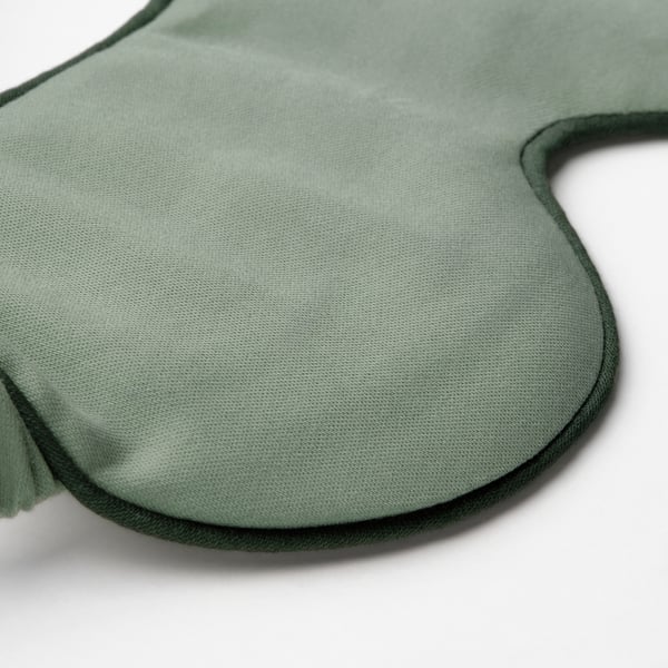 Green cotton satin eye mask with elastic comfort band, designed for relaxation.