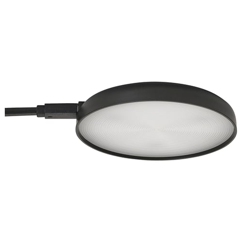 The STRIMSÄV spotlight in black. Flat, round shape, its ideal for illuminating cabinets.