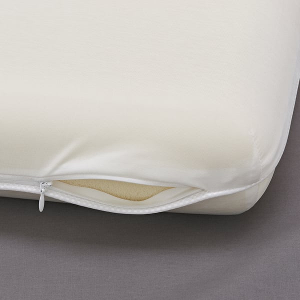 Close-up of a stylmal pillow showcasing its zippered case and memory foam layer, emphasising its quality and design.
