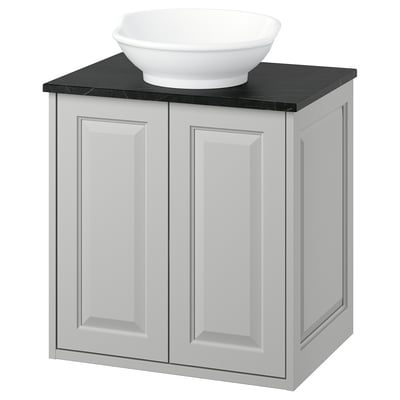 White TÄNNFORSEN bathroom cabinet with black counter and bowl sink.