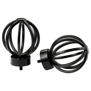 Image shows two black spherical finials made of metal, one upright and one tilted, featuring intricate loop designs.
