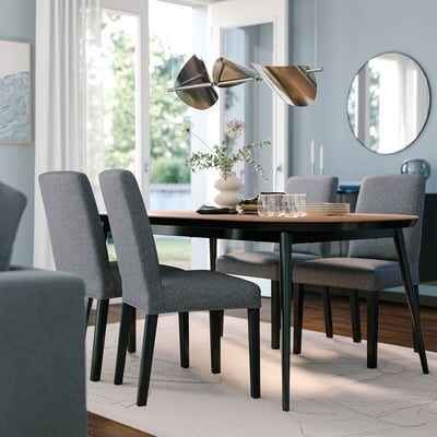 TJÄRKIL dining set: walnut table, 4 grey chairs, compact, stylish lighting.