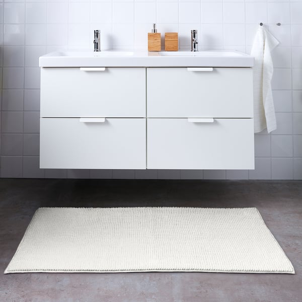 White TOFTBO microfiber bath mat, rectangular, soft & absorbent, fits under sink vanity.