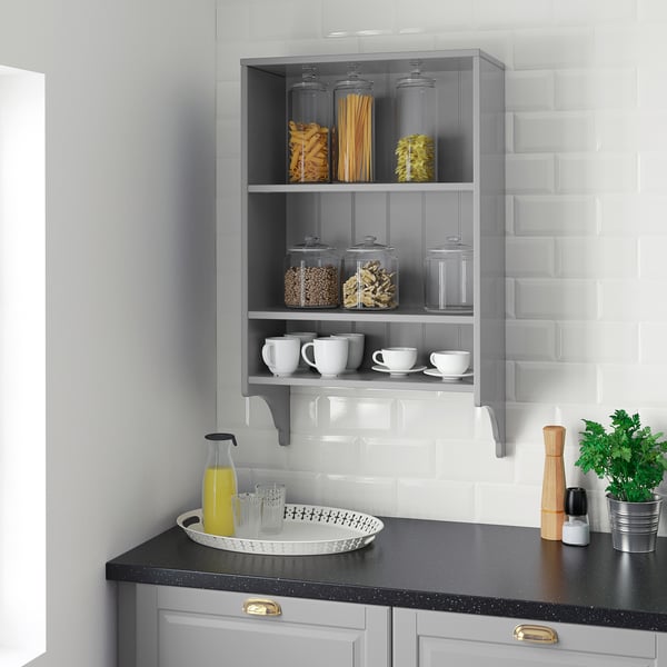 Modern kitchen with grey TORNVIKEN shelf holding containers, cups, and a jar. Clean, organised look.