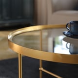 TORSJÖ Coffee table, gold effect/glass, 88 cm