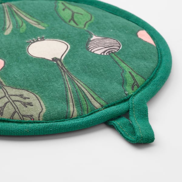 Green circular potholder with leaf and root veg designs, sewn edges.