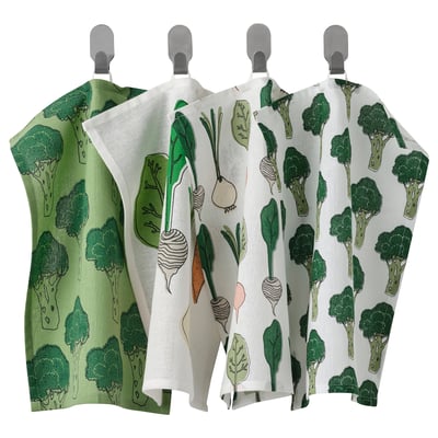 Image shows three green vegetable-themed cotton towels hanging.