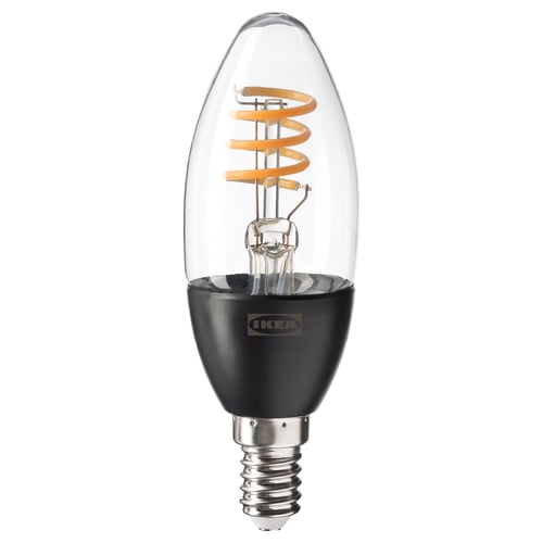A TRÅDFRI smart led light bulb by IKEA. It has a clear glass cover and a spiral filament for decorative light.