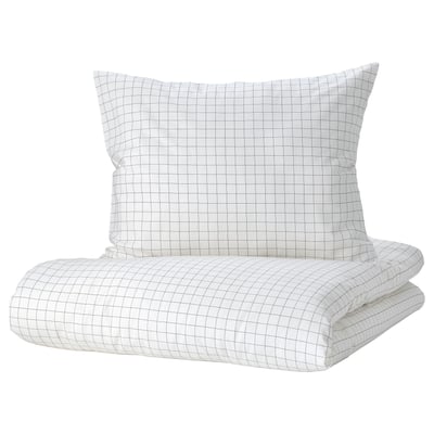 A white grid-patterned VÄNKRETS pillow and blanket set, soft cotton, clean design.