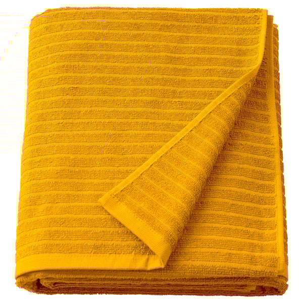 Bright yellow VÅGSJÖN towel, folded, with textured stripes, 100% cotton.
