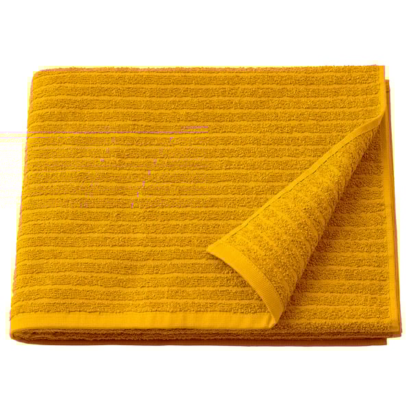Bright yellow VÅGSJÖN towel, thick and soft, folded neatly, shows textured stripes, pure cotton.