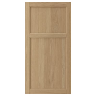 VEDHAMN natural wood cabinet door with oak panel and frame. Simple, rectangular design showcasing wood grain.