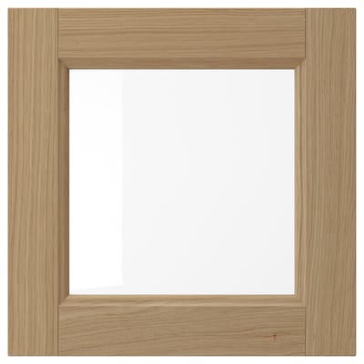 Wooden kitchen cabinet door with glass panel, oak finish, slim frame.