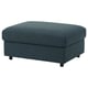 A VIMLE footstool in dark blue. Its square, upholstered in textured fabric, and has black legs. It offers storage space under the seat.