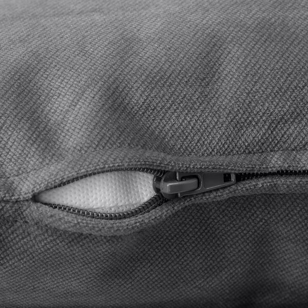 Close-up of grey vinlididen sofa zip, showing soft, textured fabric and durable zip.